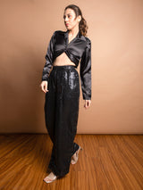 Gedraaide voortop met pailletbroek