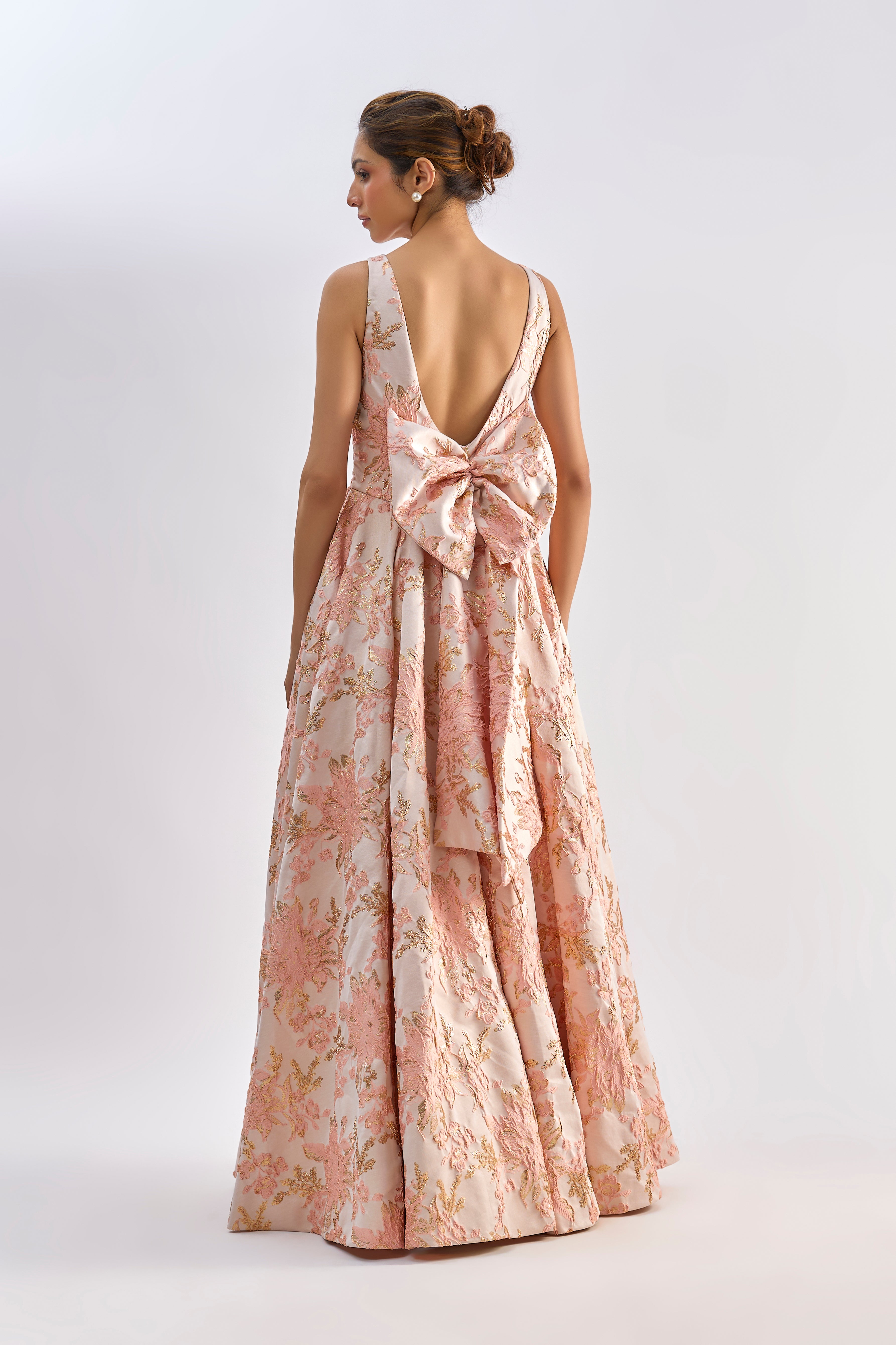 Pink floral textured jacqard gown with back bow detailing